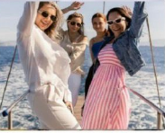 Couple smiling against colourful Austrian buildings